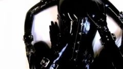 Rubberdoll In Full Ebony Latex Enclosure Takes Sprayed Her Mouth With Cum…